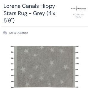 Lorna Canals washable area rug, grey, with stars and tassels. 4’x5.9’.